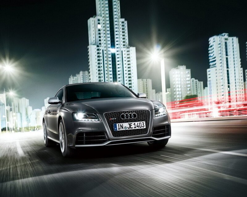 Audi RS5 in a city at night
