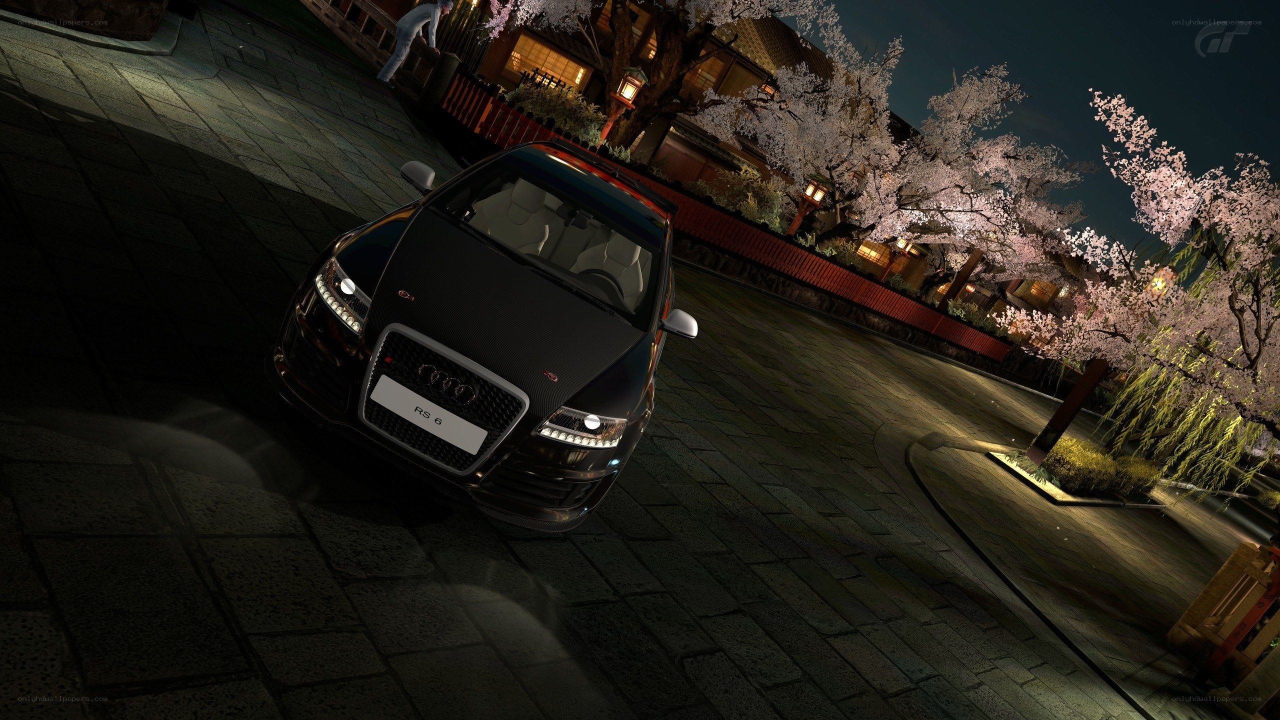 Audi RS6 at night with cherry blossoms