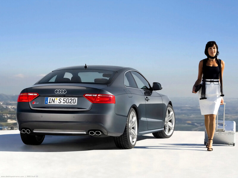 Audi S5 with woman and luggage