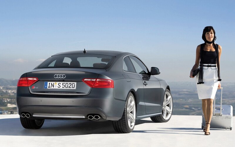 Audi S5 with woman and luggage