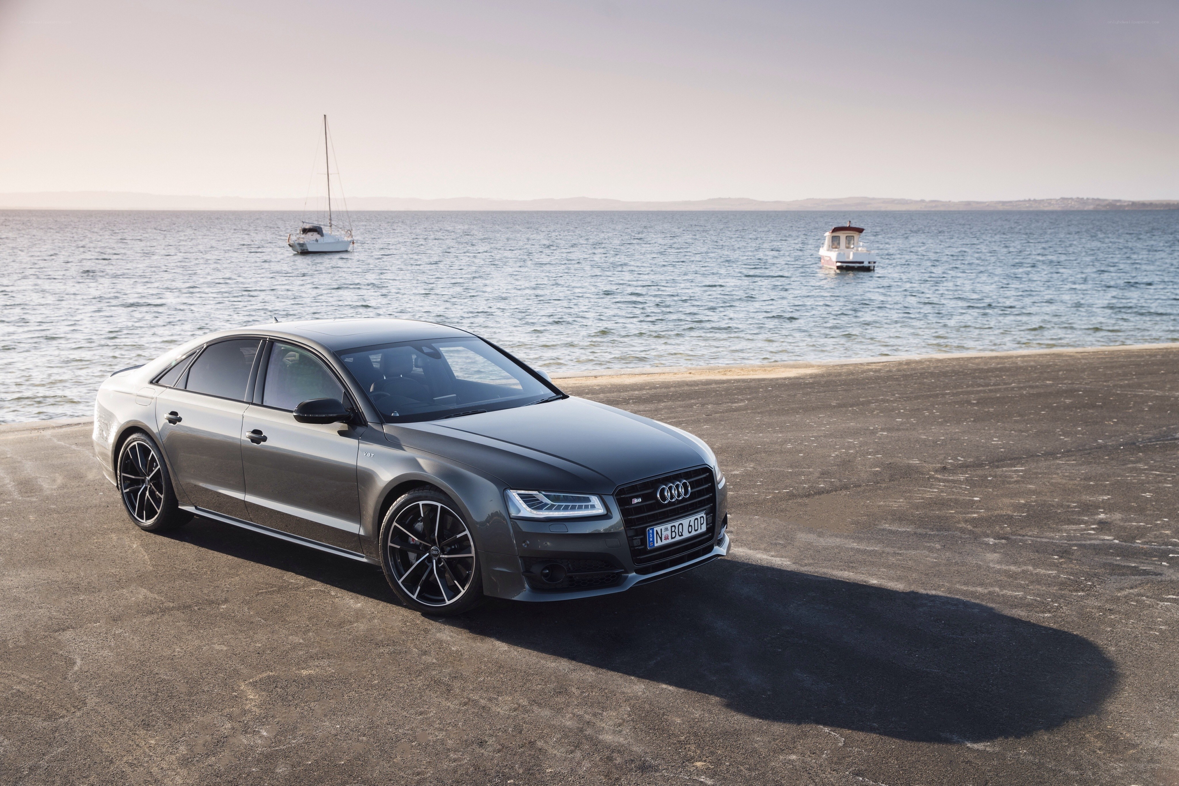 Audi S8 parked by the sea