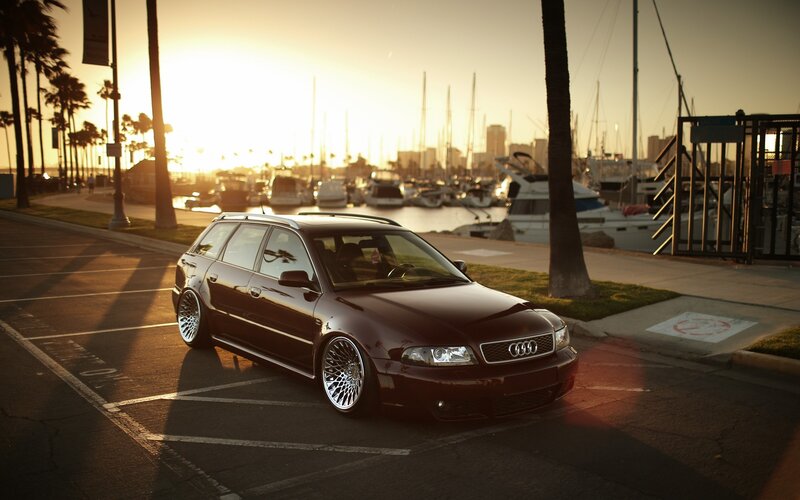 Audi station wagon at sunset by the marina