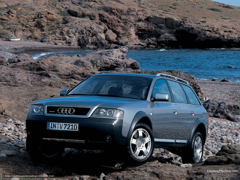 Audi station wagon on a rocky beach