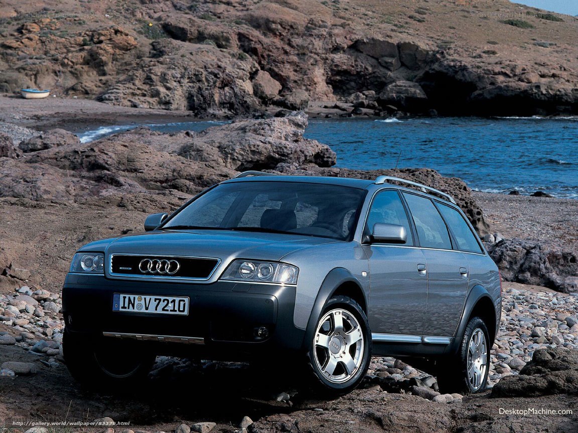 Audi station wagon on a rocky beach