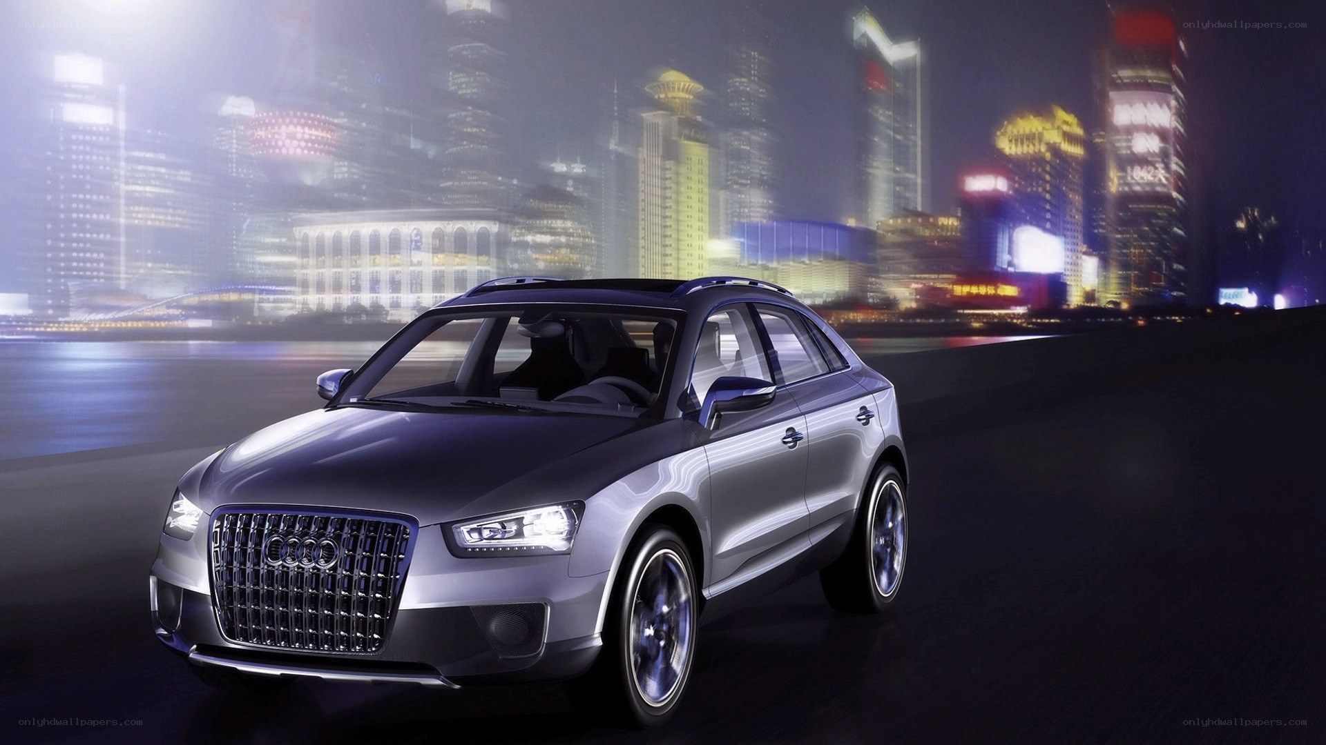 Audi SUV at night in a city