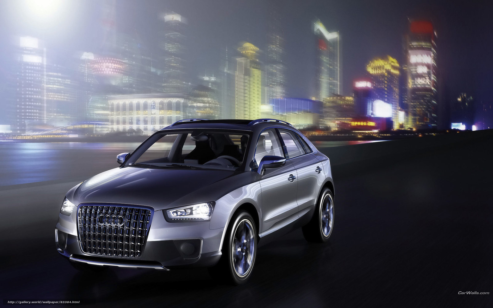 Audi SUV in city at night