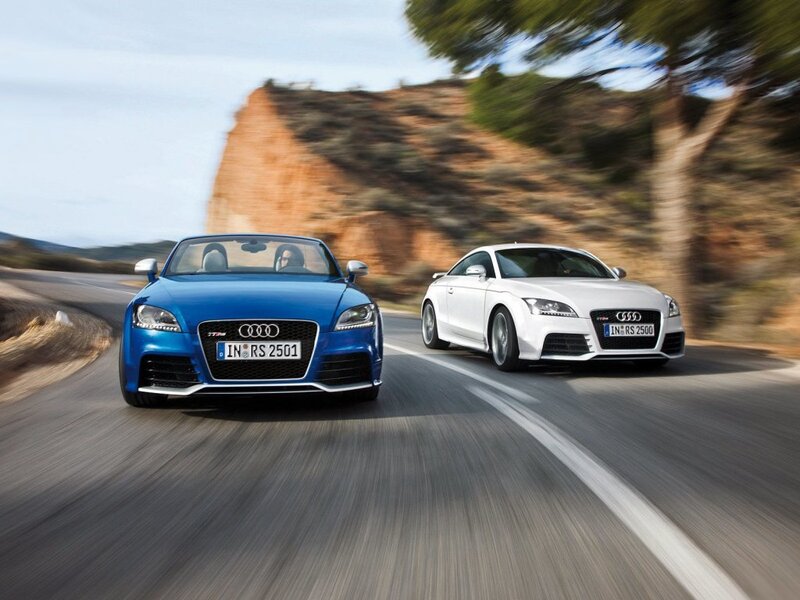 Audi TT RS cars on a winding road