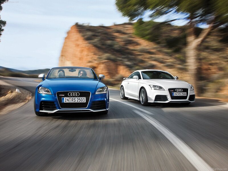 Audi TT RS cars on a winding road