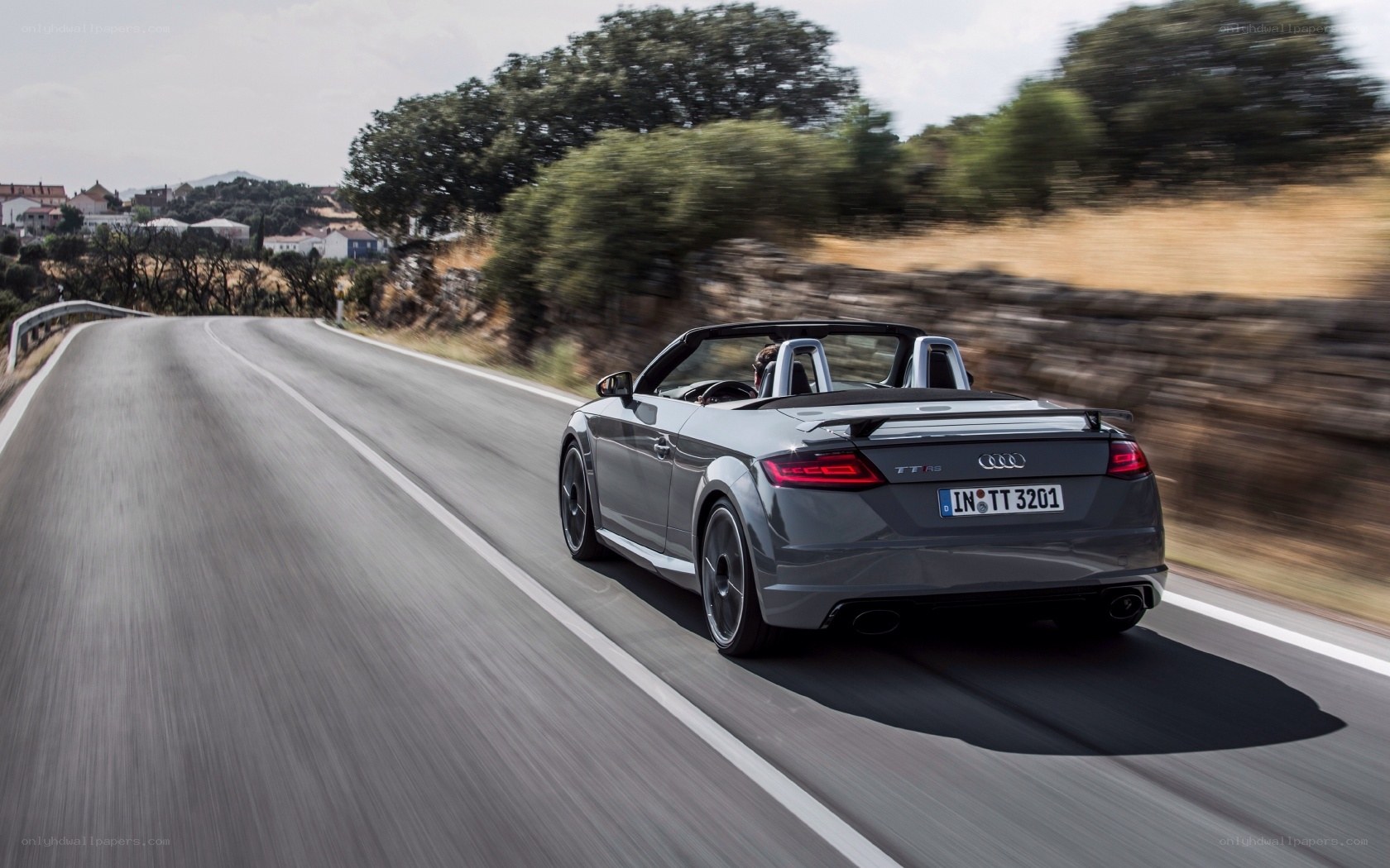 Audi TT RS driving on a road