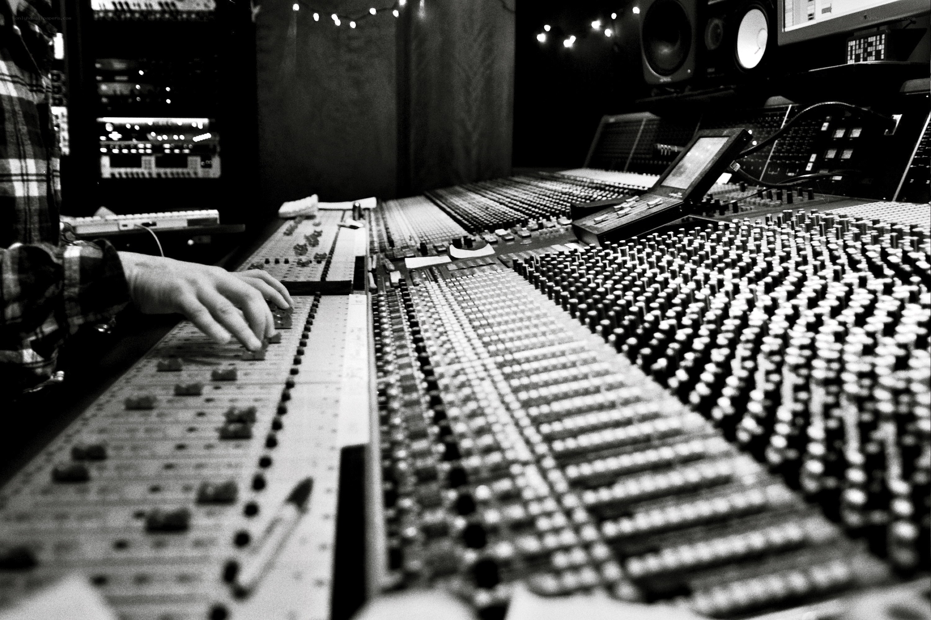 Audio engineer at mixing console