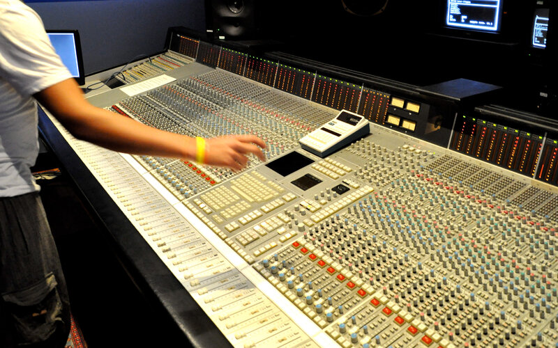 Audio engineer at mixing console