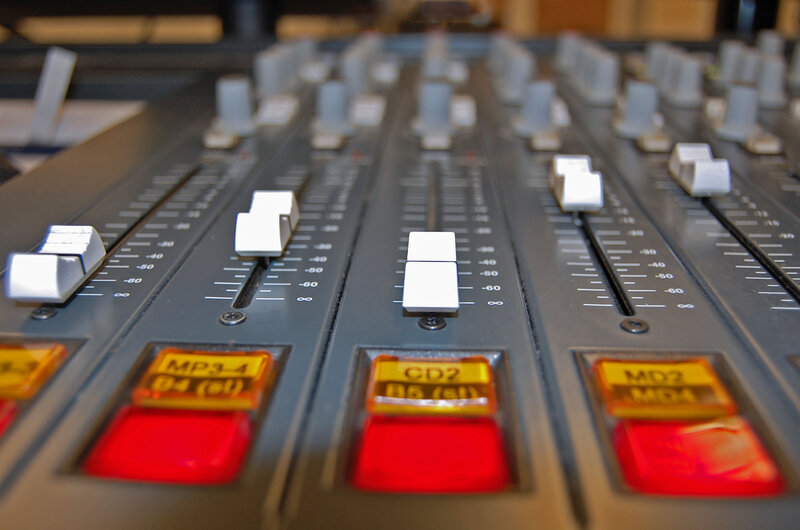 Audio mixer with faders and buttons