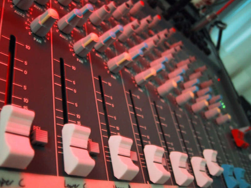 Audio mixer with faders and knobs