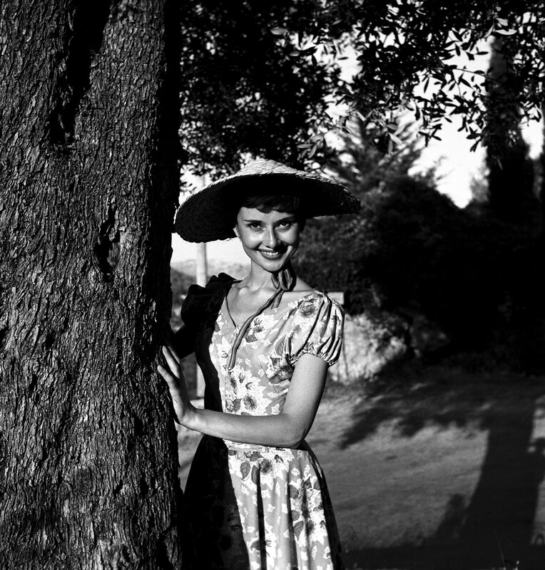 Audrey Hepburn by a tree