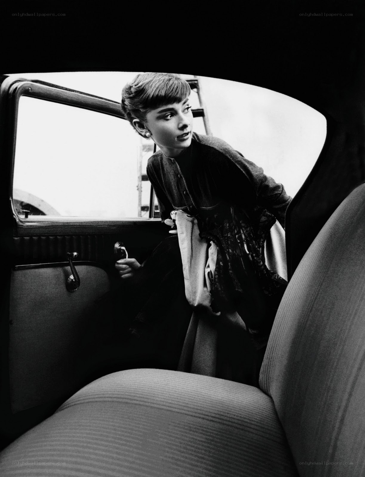 Audrey Hepburn in a car