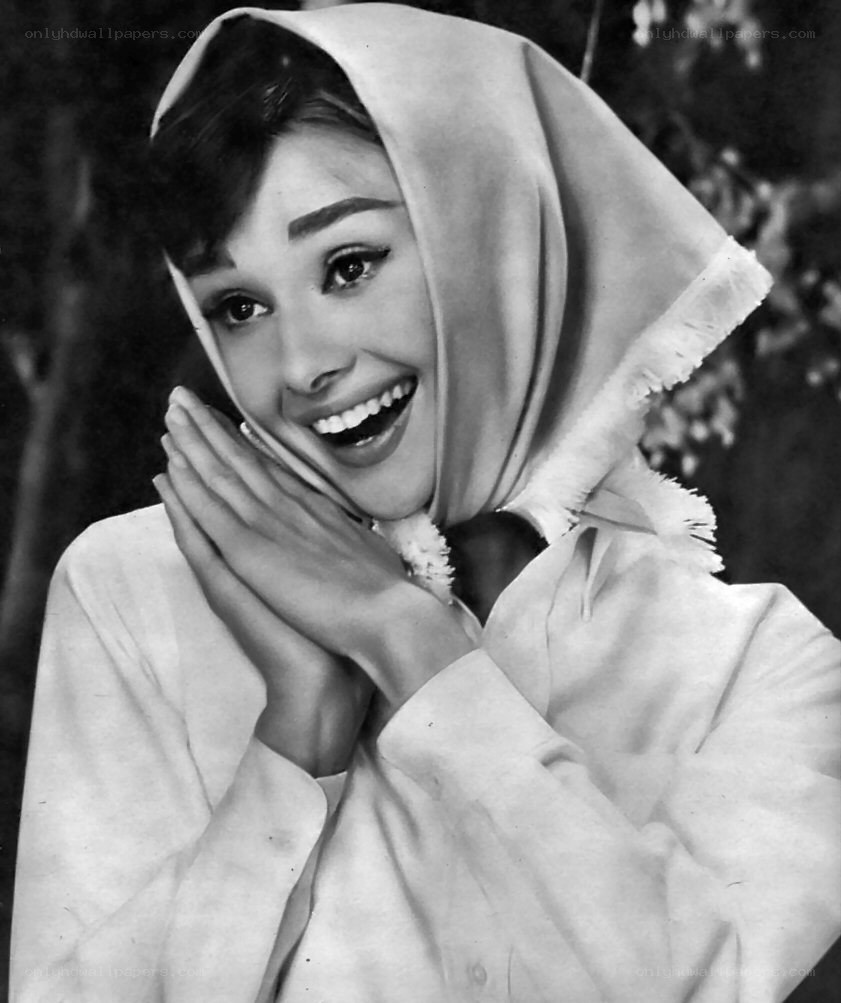 Audrey Hepburn smiling with scarf