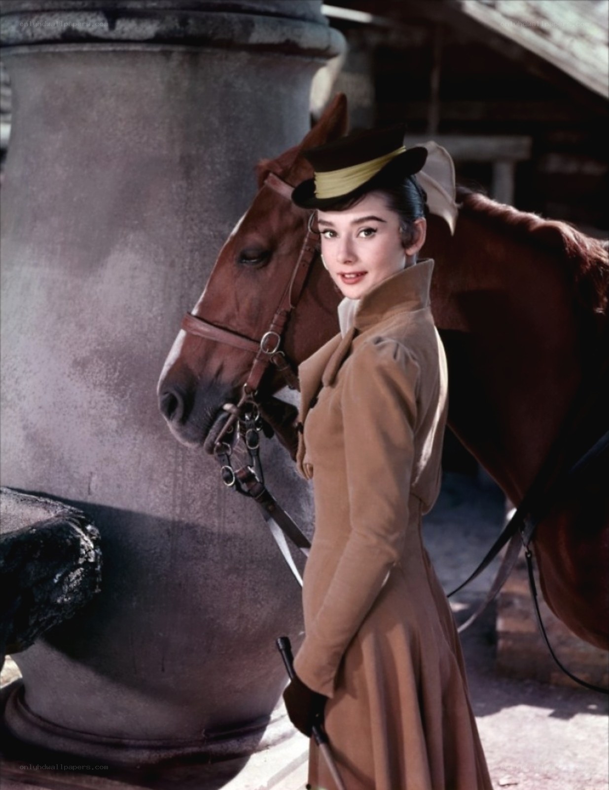 Audrey Hepburn with a horse