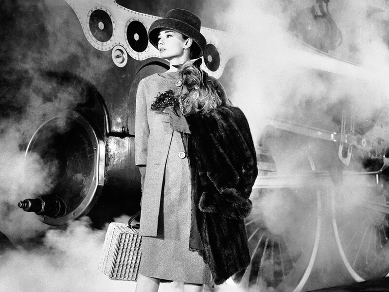 Audrey Hepburn with dog and suitcase