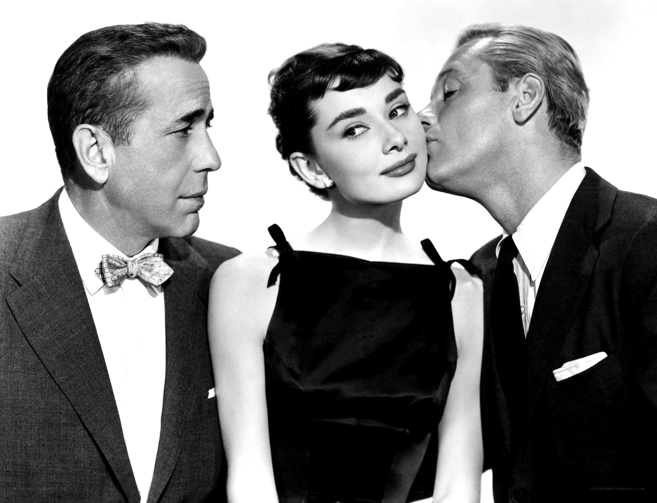 Audrey Hepburn with two men