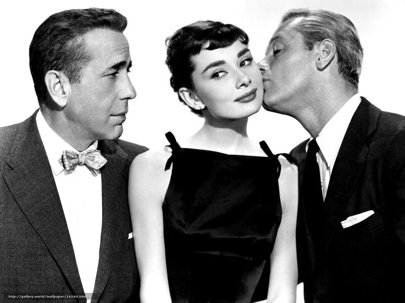 Audrey Hepburn with two men