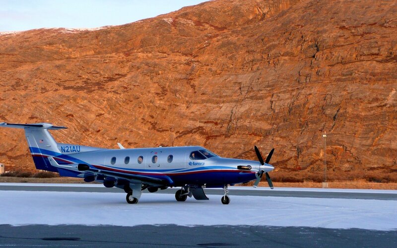 Aurora aircraft on snowy runway