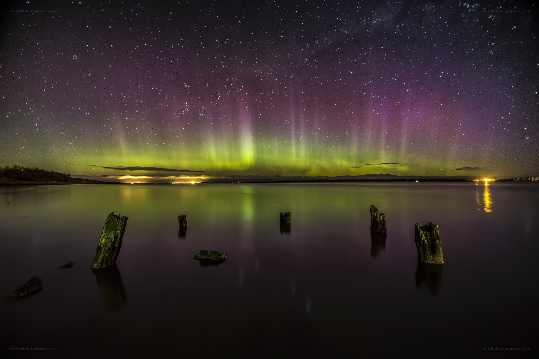 Aurora borealis over a calm lake