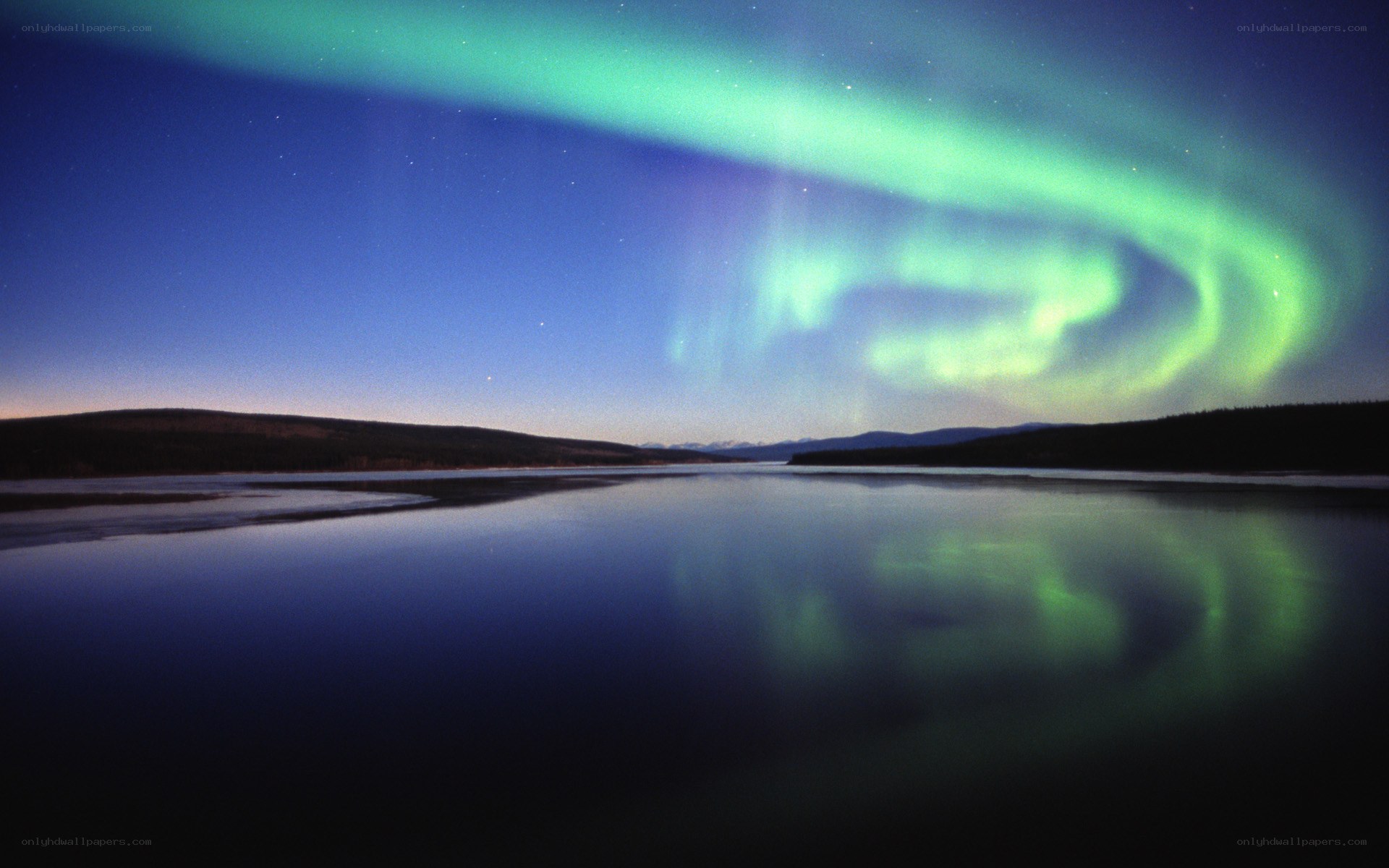 Aurora borealis over a calm lake