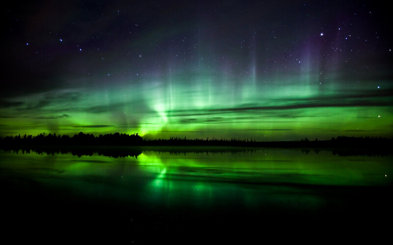 Aurora borealis over a lake