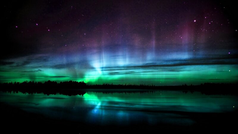 Aurora borealis over a lake