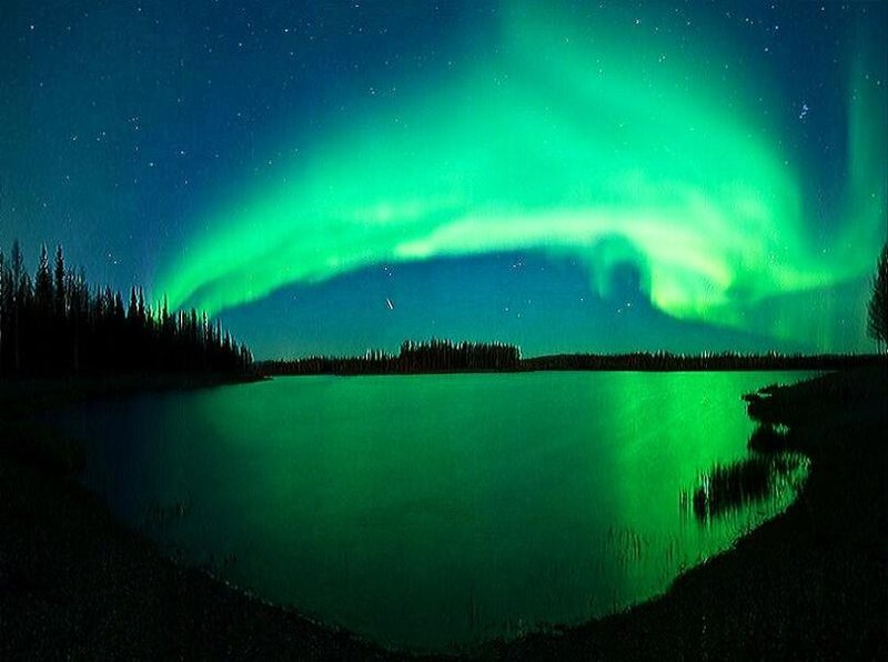 Aurora borealis over a lake