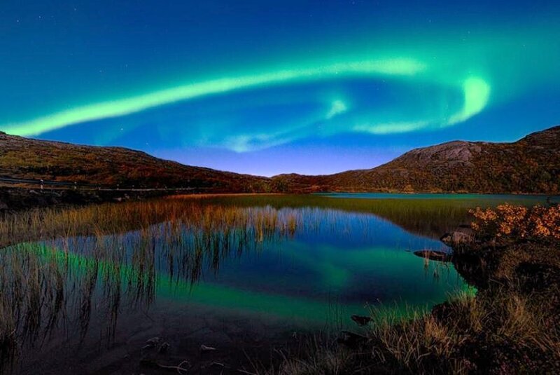 Aurora borealis over a lake