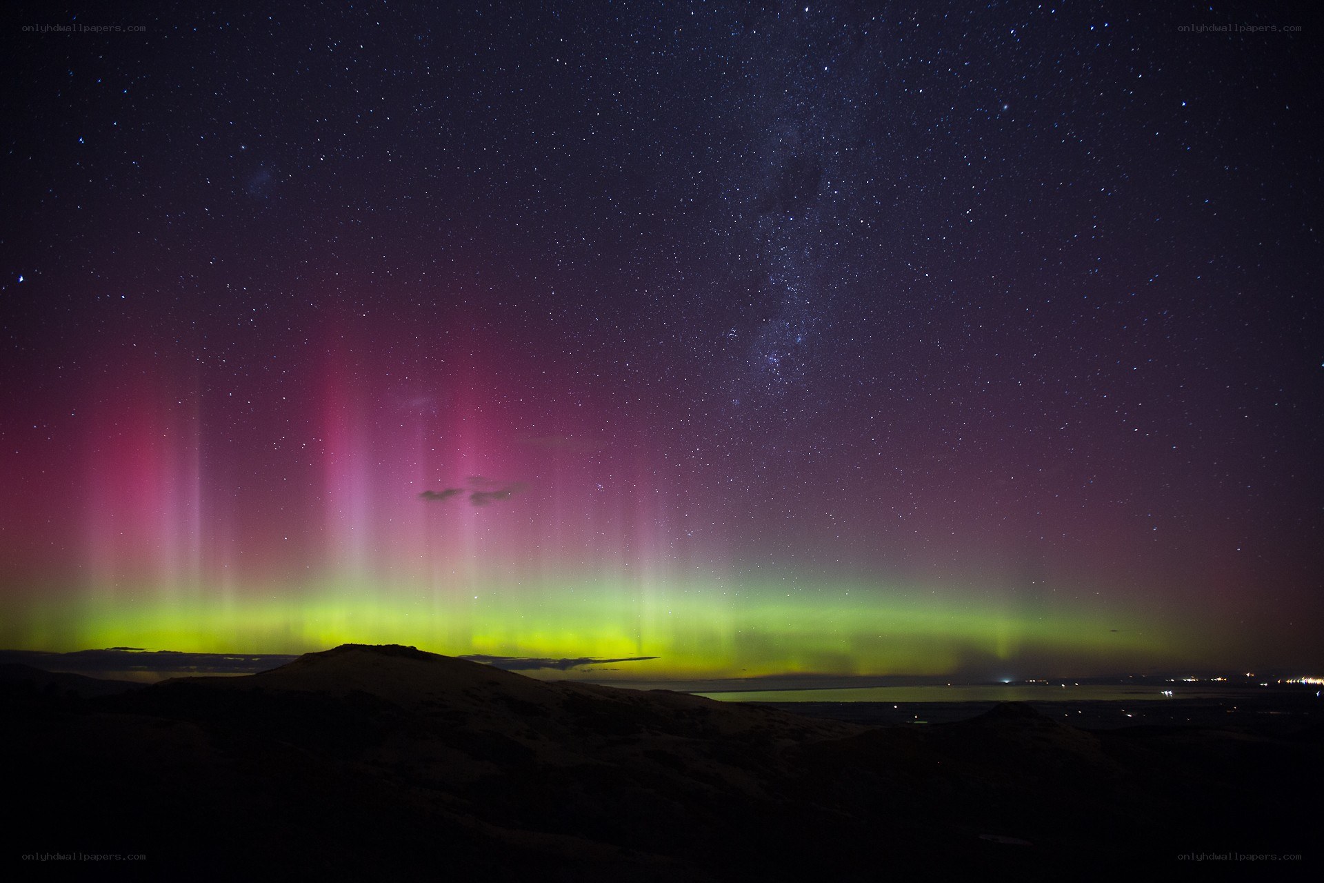 Aurora borealis over a mountain