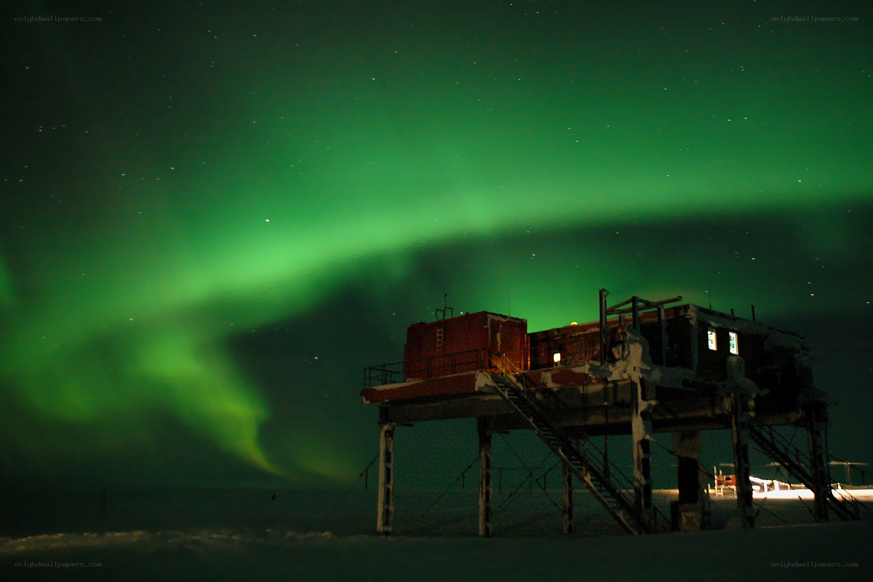 Aurora borealis over a research station