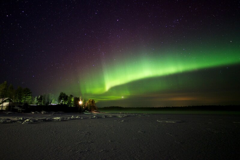 Aurora borealis over a snowy landscape