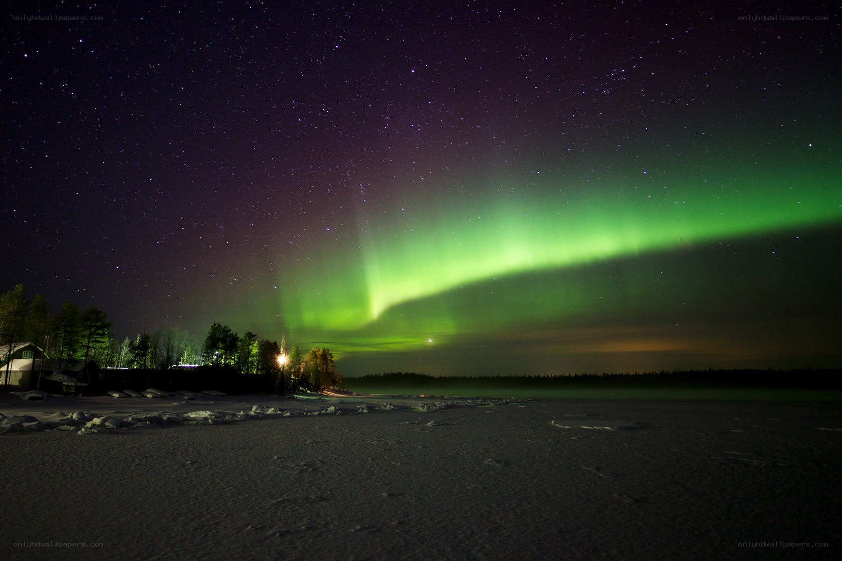 Aurora borealis over a snowy landscape