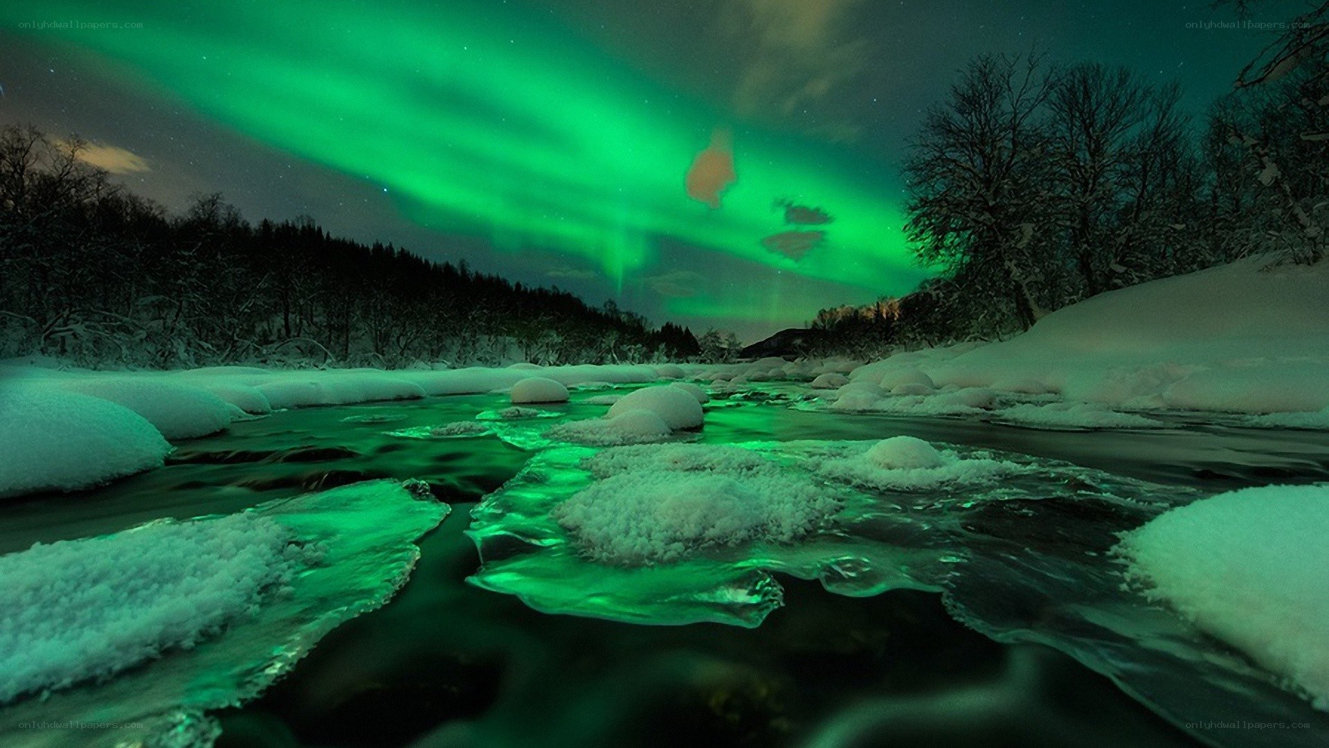 Aurora borealis over a snowy river