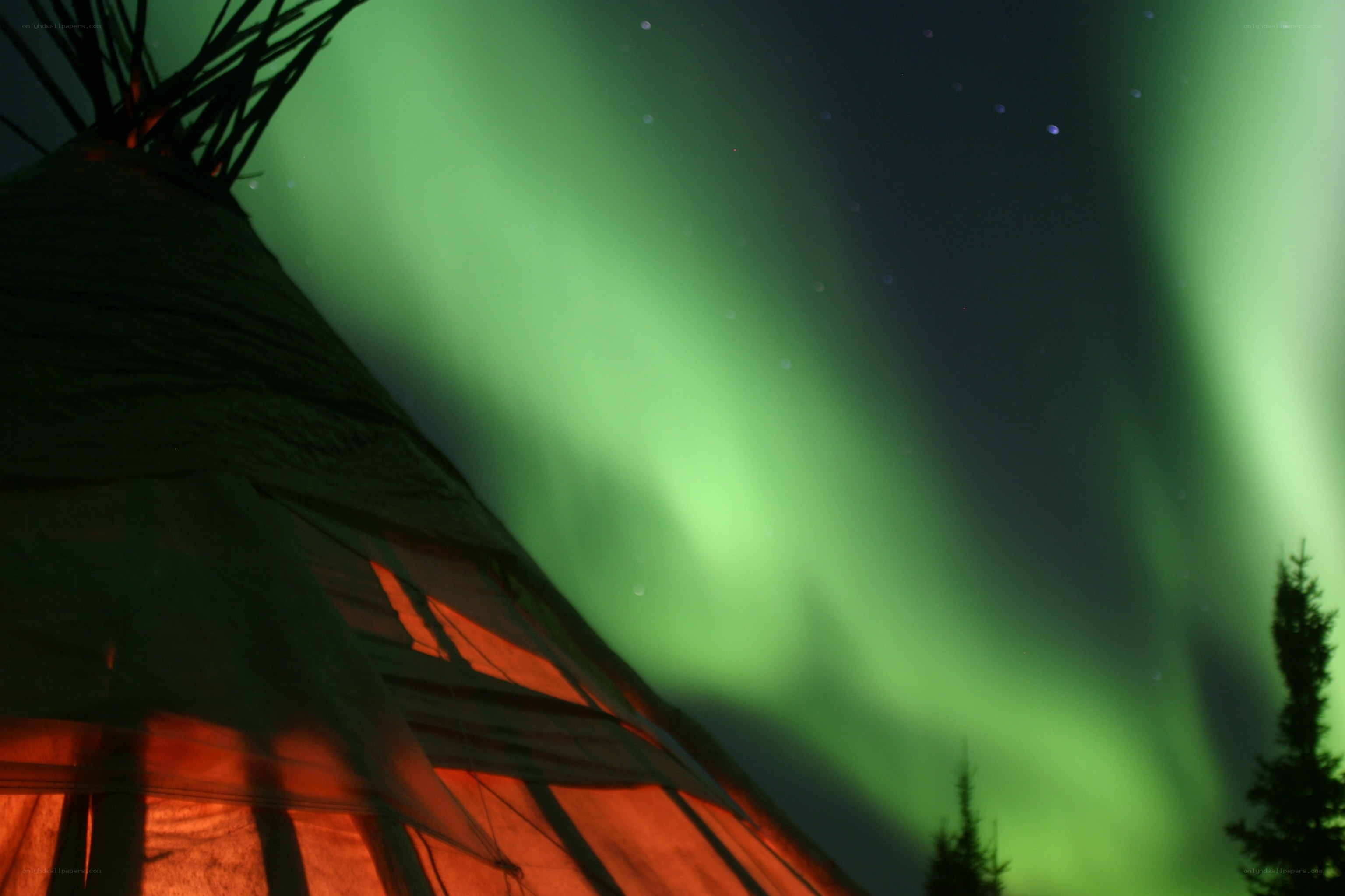 Aurora borealis over a teepee