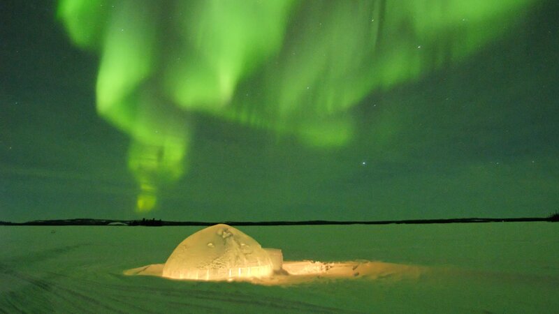 Aurora borealis over an igloo