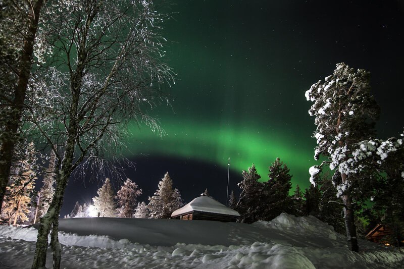 Aurora Borealis over Cabin — Green, Serene, Night
