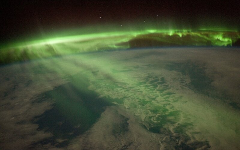 Aurora Borealis over Earth — Green, Dramatic, Night