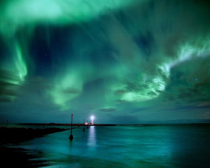 Aurora borealis over lighthouse
