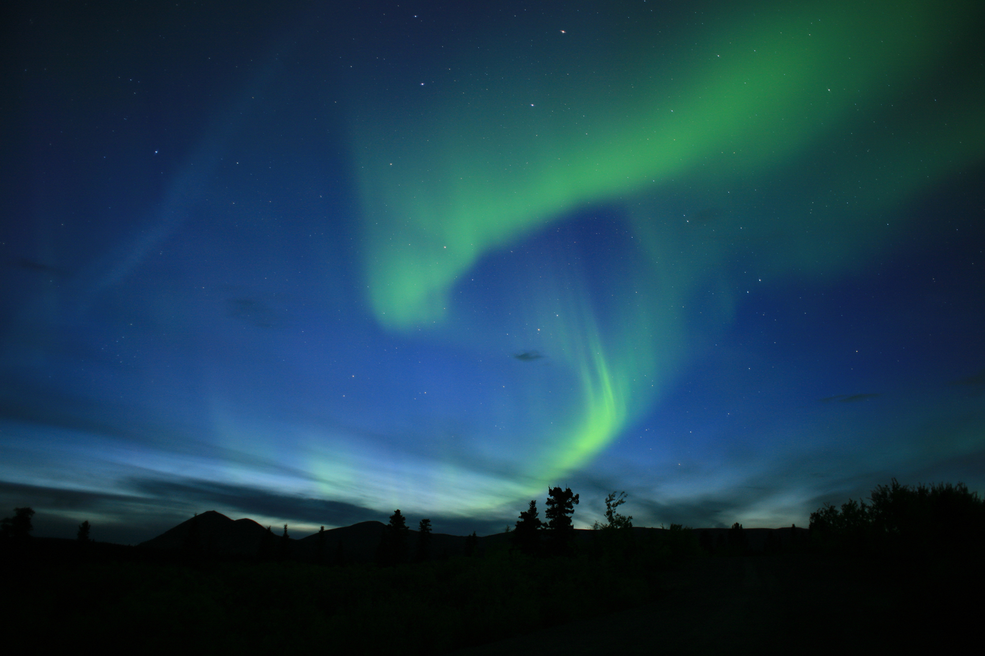 Aurora borealis over mountains
