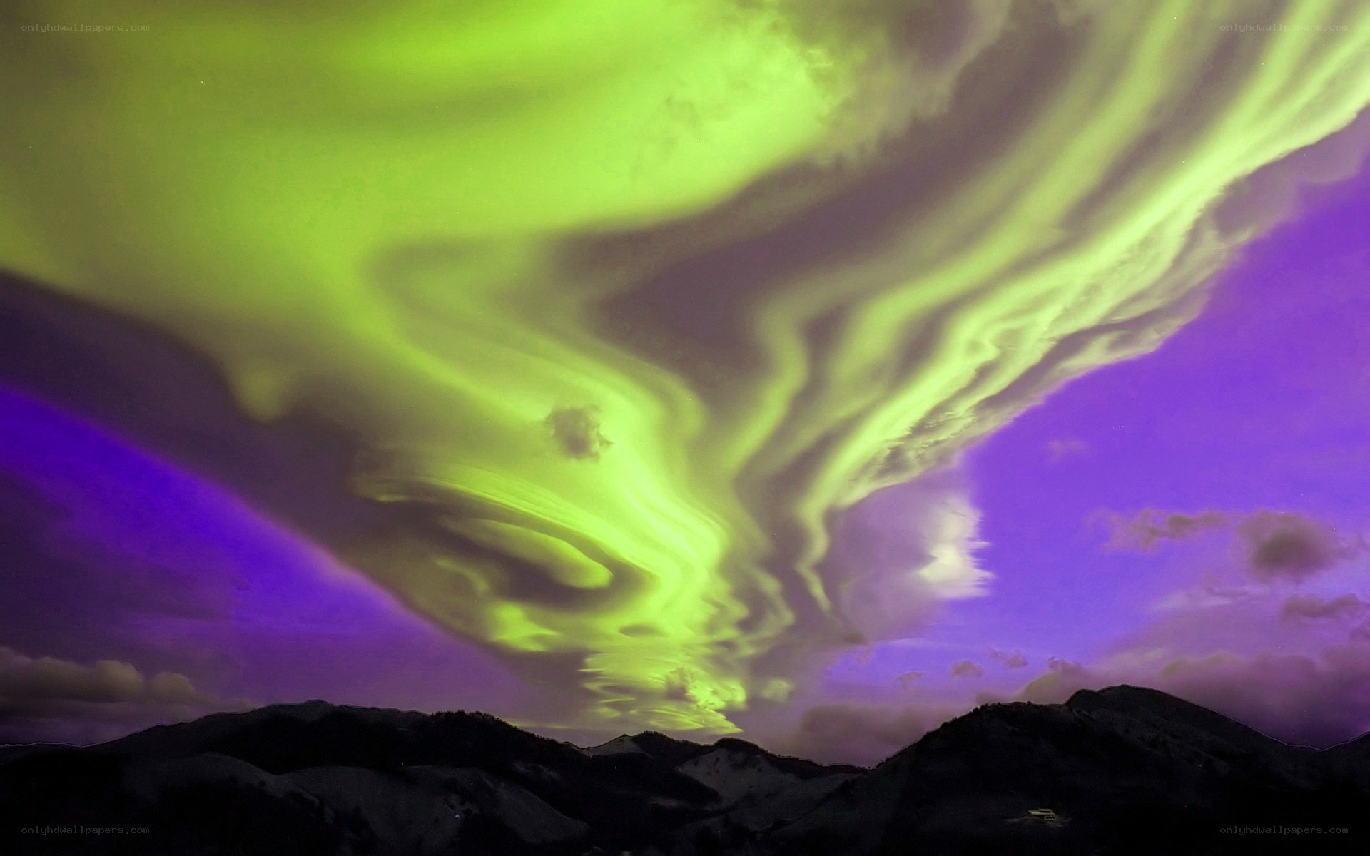 Aurora borealis over mountains