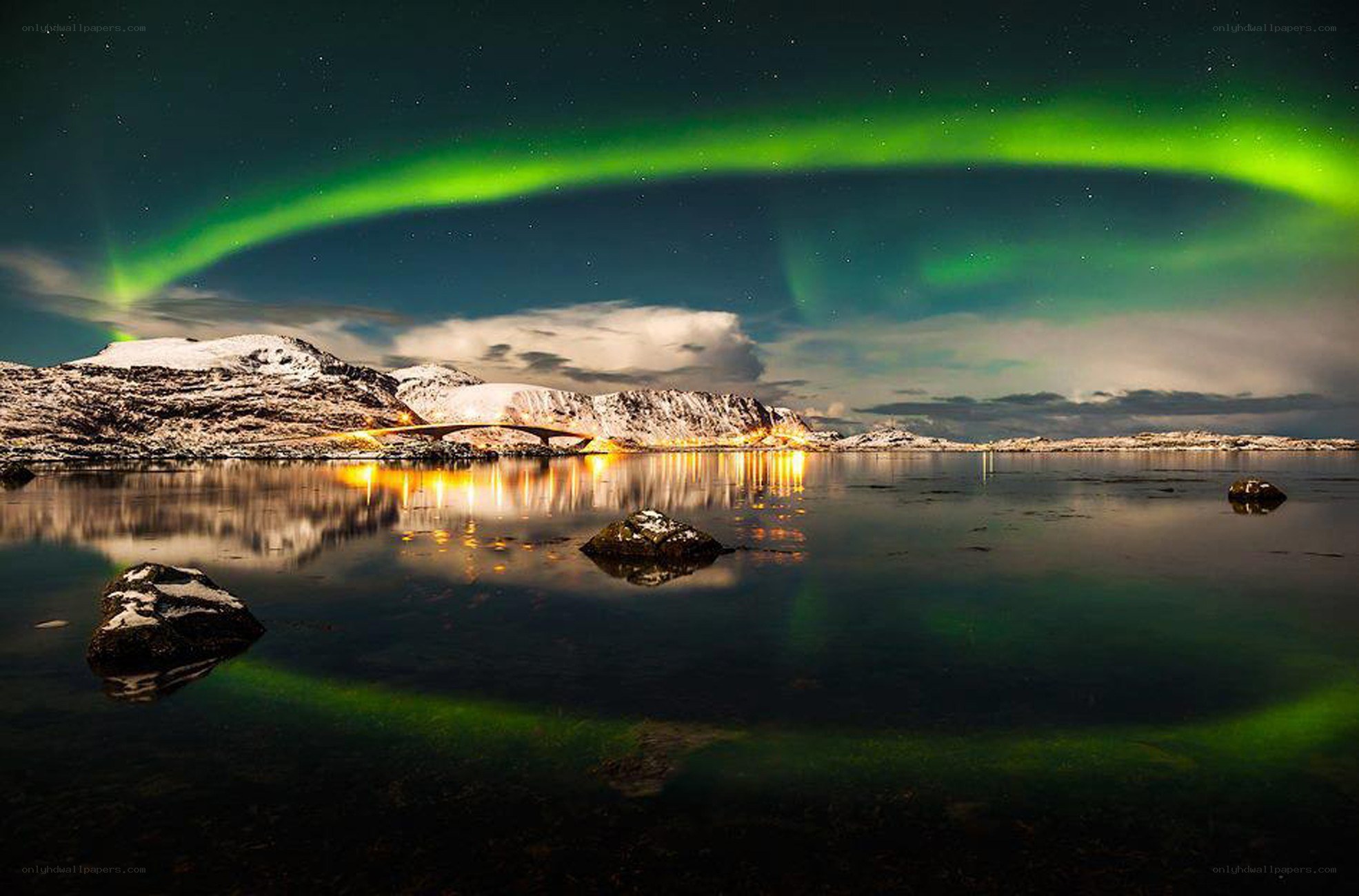 Aurora borealis over snowy mountains