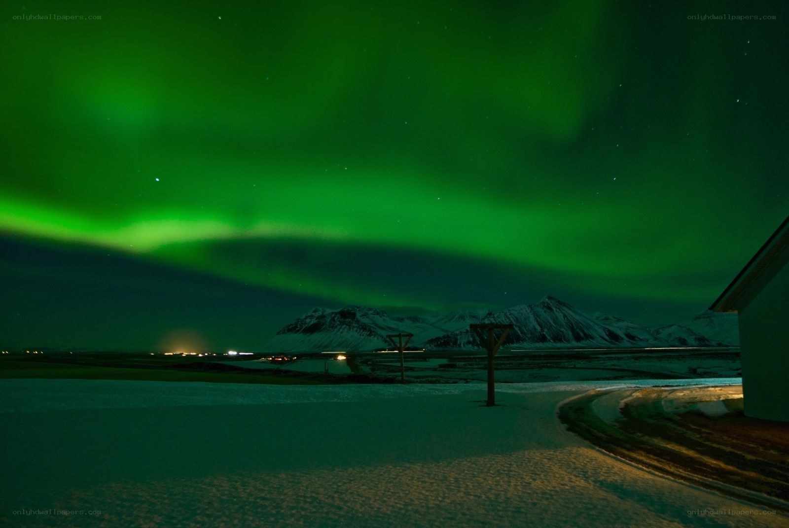 Aurora borealis over snowy mountains