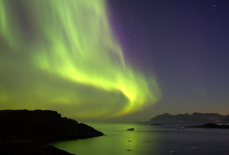 Aurora Borealis over Water — Green, Serene, Night, Photograph, Stars