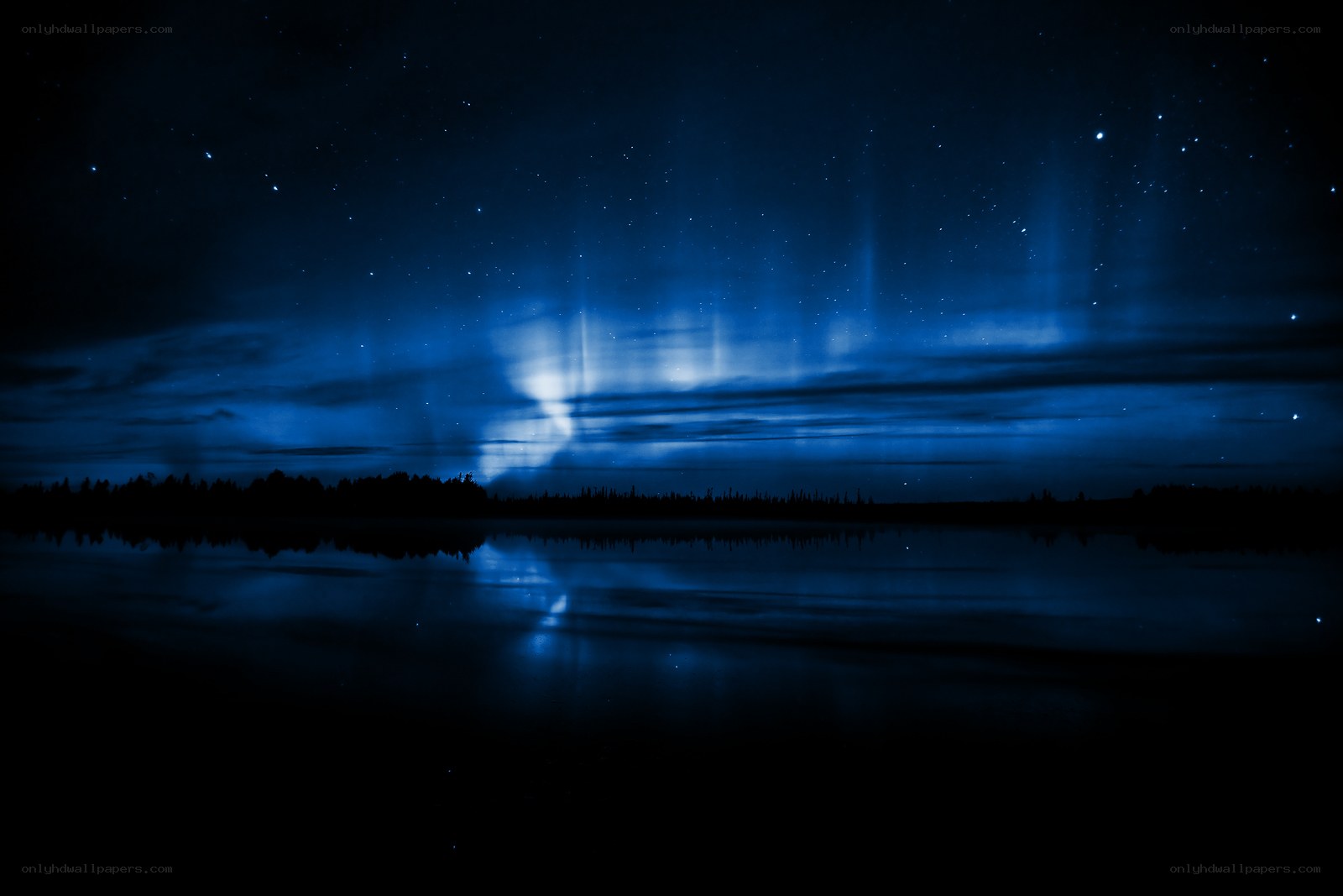 Aurora over a calm lake