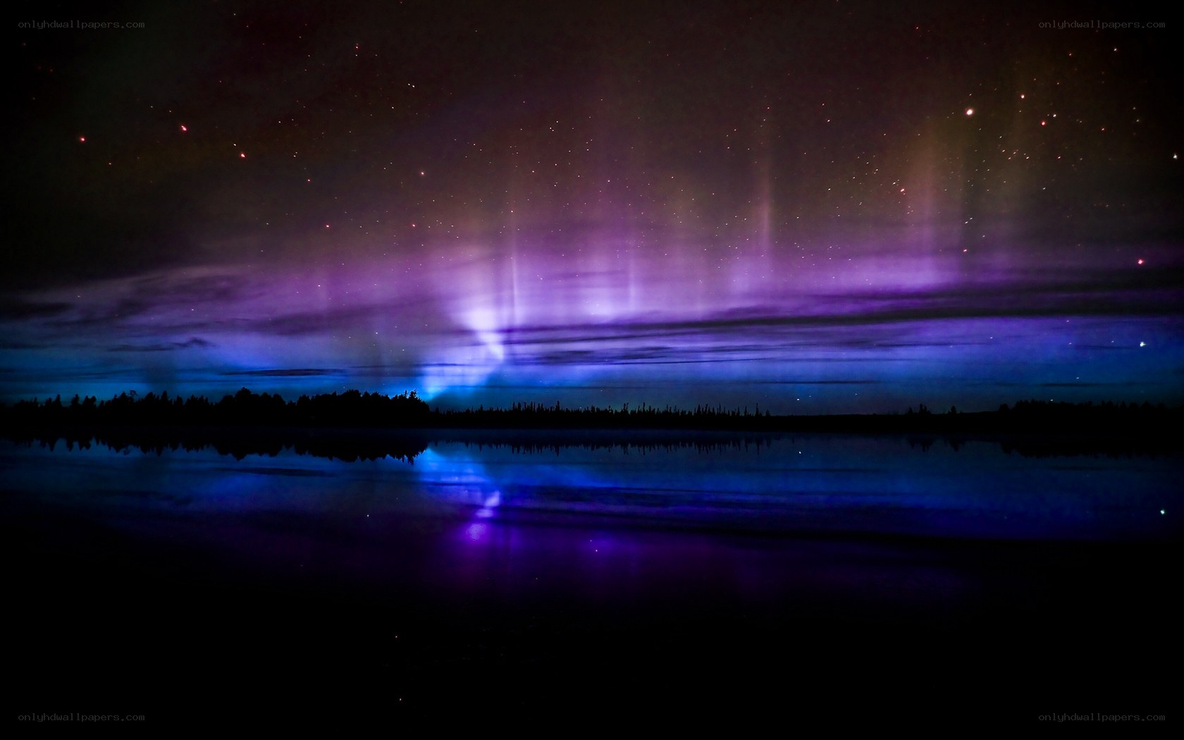 Aurora over a calm lake