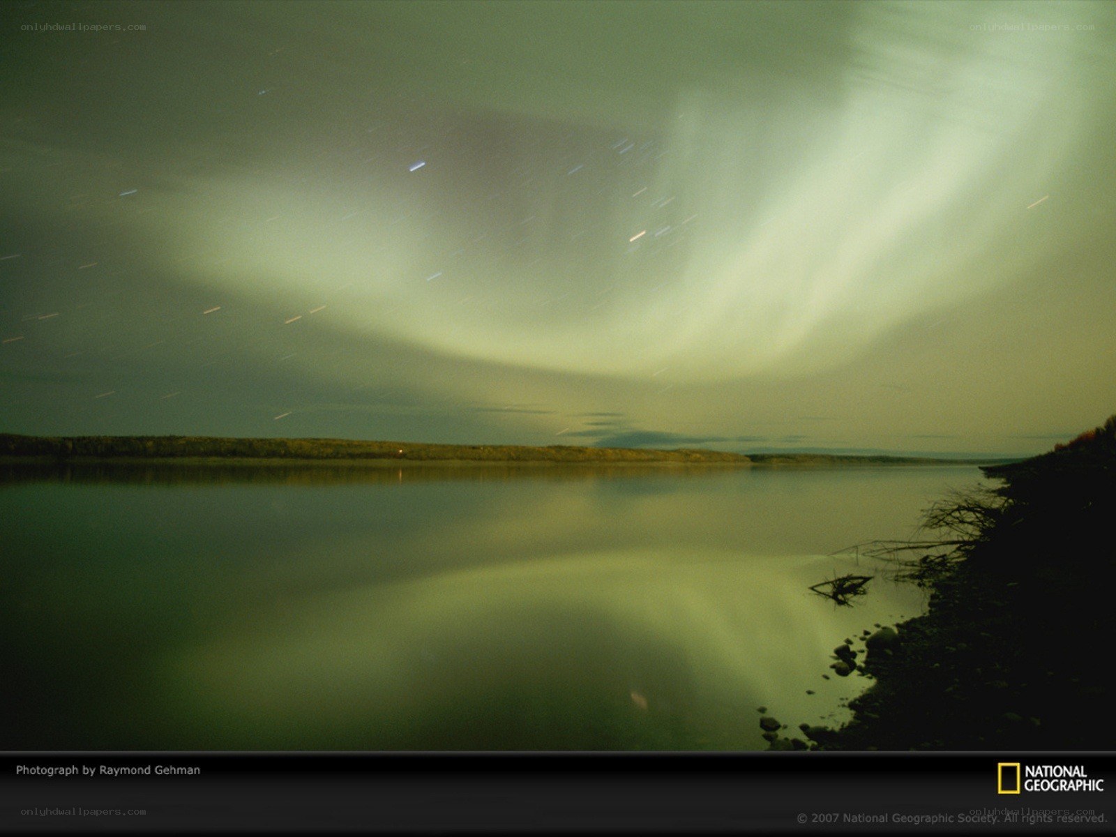 Aurora over a calm lake