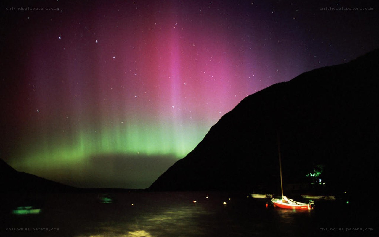 Aurora over a coastal bay